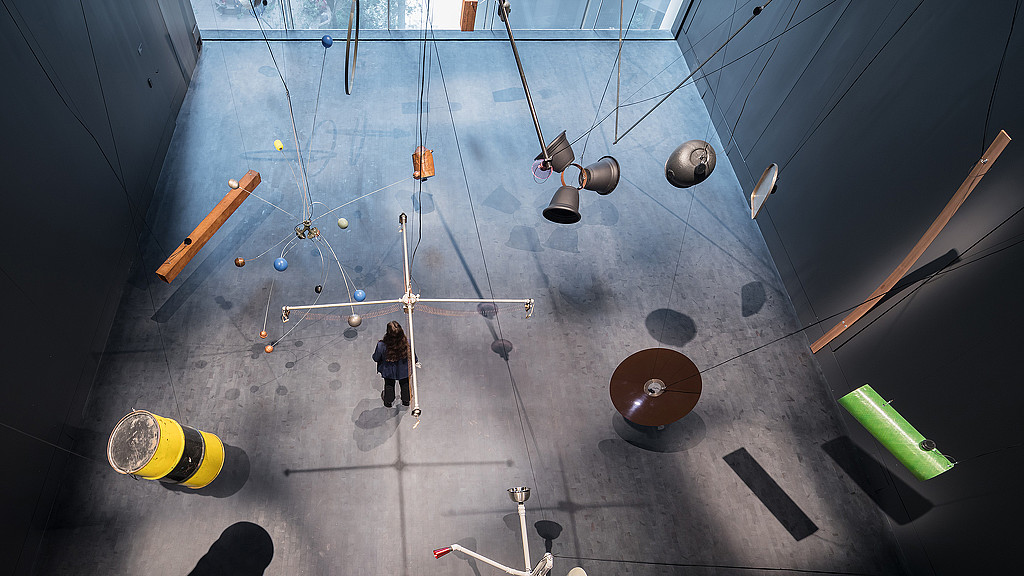 A person walking on a bridge.